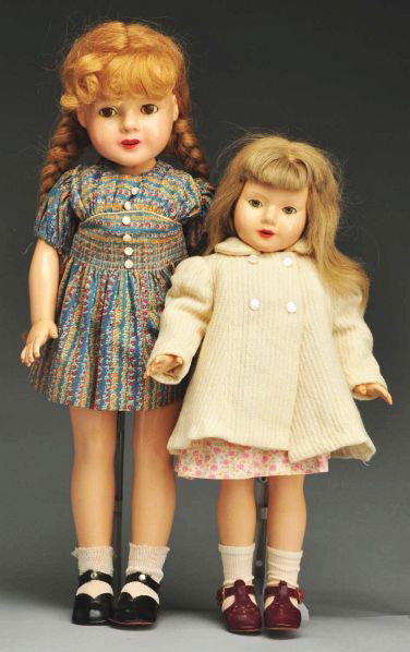 Lot of 2: Dewees Cochran Composition Dolls.: Description Both by Effanbee. Larger with lashed brown sleeping eyes (cloudy), blonde human hair wig with braids, open mouth with teeth (light crazing on face, lips repainted, touch up around mouth, l
