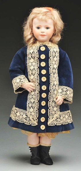 Original Artist Doll by Polly Mann.: Description Bisque shoulder head with sweet child face, blue glass inset eyes, closed mouth, pierced ears (one earring missing), blonde human hair wig; cloth body signed and dated by Polly Mann, bisqu