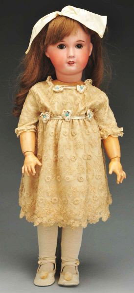 SFBJ Bébé Doll.: Description French bisque socket head incised "France SFBJ Paris" with remnants of red Tête Jumeau stamp, so-called Jumeau mold (long hairline from crown rim down below chin and around behind ear to 