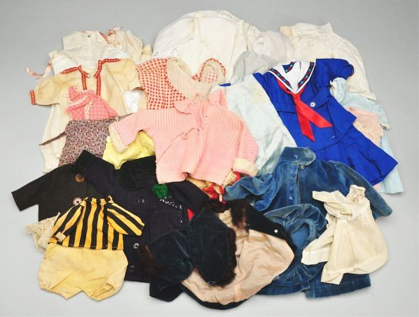 Large Lot of Antique Doll Clothing.: Description Tagged suit for 1910 Campbell Kid; pink knitted sweater; Kruse-type chemise with braid trim; pique sailor-style waist; white work blouse, 3 romper suits for toddlers or babies; 3 cotton ap