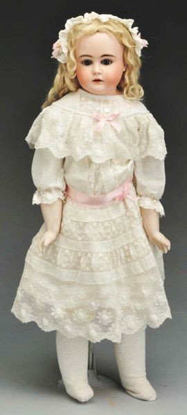 Large Kestner Child Doll.: Description Turned bisque shoulder head incised with "N". Multistroked eyebrows, sleeping eyes with upper and lower painted lashes, open mouth (no teeth), antique blonde mohair wig; kid body with rive