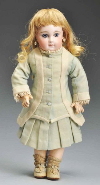 Fabulous Portrait Jumeau Bébé Doll.: Description French bisque socket head incised 6 made by Emile Jumeau with original neck coil, creamy bisque (black speck on temple) with multistroked eyebrows, blue paperweight eyes with threaded pupi