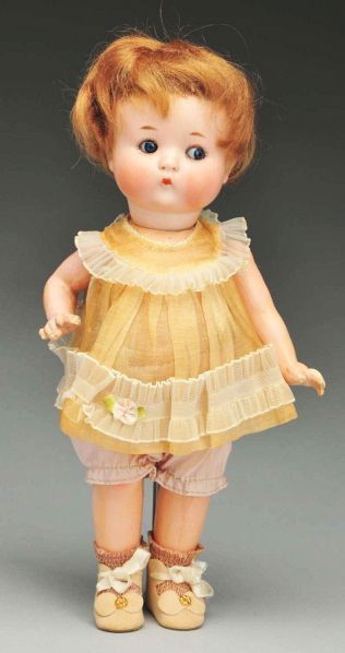 Cute "Just Me" Character Doll.: Description German bisque socket head incised "Just Me Registered Germany A 310 5/0 M." Tapered eyebrows, tiny blue side-glancing eyes, painted upper and lower eyelashes, tiny closed mouth, original m