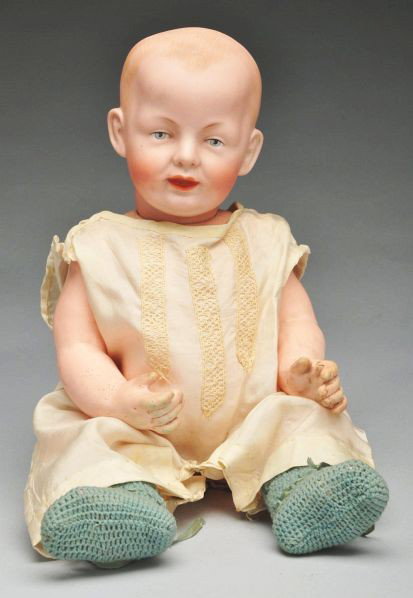 Rare Franz Schmidt 1267 Character Baby Doll.: Description German bisque socket head incised F.S. & Co. with mold number, solid dome head with painted and molded hair, painted blue eyes with black eyelid line and molded upper eyelid, white dot hig