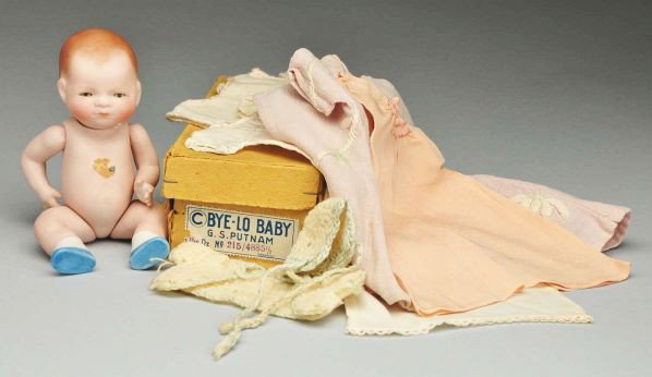 All-Bisque "Bye-Lo Baby.: Description Fully marked on back "Copr. By Grace S. Putnam Germany" with remains of green sticker on tummy, swivel neck with glass eyes (short firing crack in outer corner of left eye), closed mouth, 