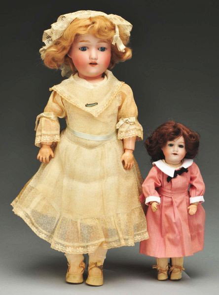 Lot of 2: Japanese Bisque Dolls.: Description Both with bisque socket heads and jointed composition bodies. Larger FY Nippon girl with original mohair wig, sleeping eyes, possibly original clothing with hat, shoes and socks (buckle br
