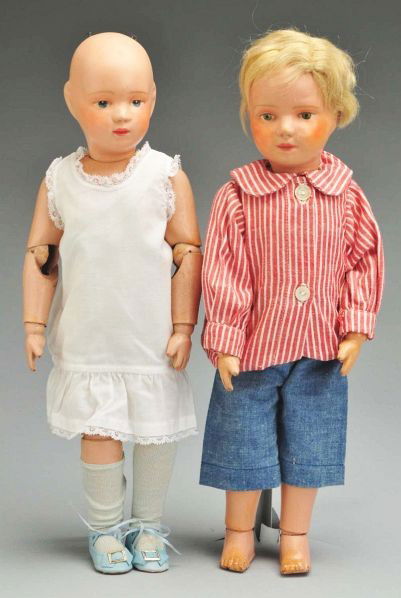 Lot of 2: Schoenhut Character Dolls.: Description Both all wood and spring jointed with Schoenhut mark. Both have refinished faces. Boy has original blonde mohair wig (sparse) with rounded eyeballs; girl has intaglio eyes, original undies
