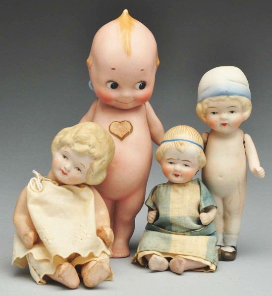 Lot of 4: Bisque Dolls.: Description Germany Rose O"Neill Kewpie signed on foot with heart label; 3 Nippon dolls: girl with molded blue and white hat, all-bisque baby with blue hair band, baby with molded blonde hair on compo