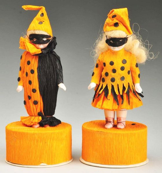 Lot of 2: Halloween Doll Candy Containers.: Description Each has a German all-bisque doll mounted on the candy box. Dolls have painted facial features, blonde mohair wigs, jointed shoulders and hips with pink molded boots, probably made by Hert