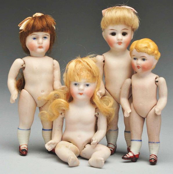 Lot of 4: All-Bisque Dolls.: Description Kestner 150 character girl with sleeping eyes, original blonde mohair wig (sparse in back); Kestner girl with flat bottom and curved legs to sit on a chair or shelf edge, original blonde m