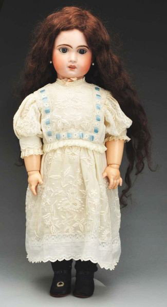 Jumeau 1907 Bébé Doll.: Description French bisque socket incised 1907 (large crack on neck socket at back of head), multistroked eyebrows, sleeping blue eyes, painted upper and lower eyelashes, open mouth with teeth, pierced