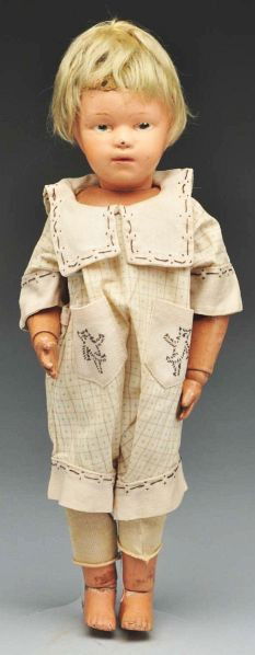 Cute Schoenhut Character Doll.: Description All wood and spring jointed with Schoenhut mark. Original face paint (flake on nose, some soil), feathered eyebrows, intaglio blue eyes, pouty mouth, original mohair wig; nicely redressed,