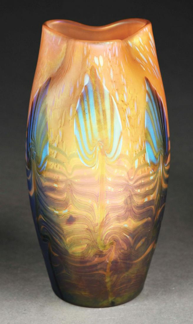 RARE LOETZ LOTUS LEAF VASE.: A beautiful and very rare vase by Loetz. The 10" tall vase has a background of gold and purple-blue iridescent glass. Further decorating the vase are gorgeous lotus leaves in highly-iridescent blue an