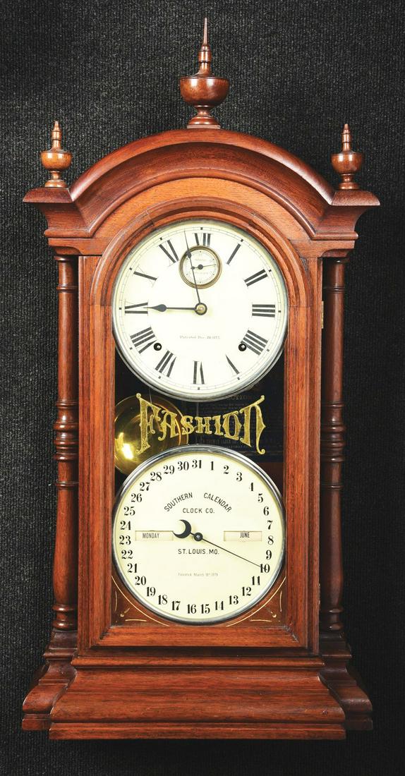 SETH THOMAS #4 "FASHION CLOCK" CALENDAR CLOCK.: The clock is a perpetual calendar, double dial with an inset seconds bit. The case is walnut. The bezel on the seconds part is nickel plated. It has a short wooden pendulum with brass bob. The time an