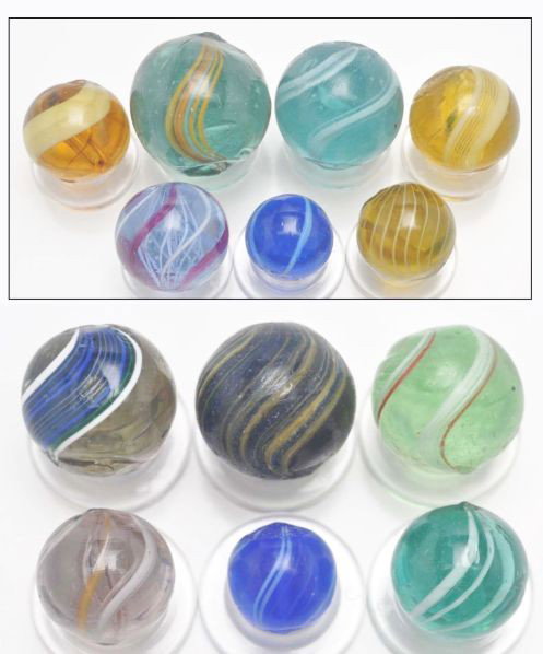 Lot of 13: Handmade Marbles.: Description Includes seven banded transparents, one gooseberry, two corn husks, one tinted glass swirl, and two maglite Indians. Largest marble has a cold roll mark. Photo list: A (marbles in inset). 