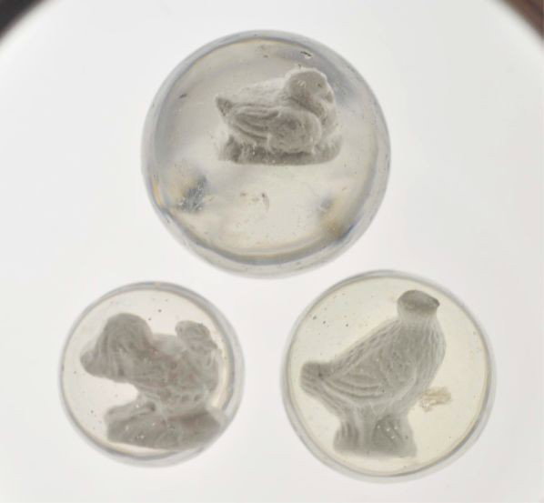 Lot of 3: Sulphide Marbles.: Description The smaller marble is a rooster figure. Photo list: B. The larger marble is a duck nesting/sleeping figure. Photo list: B, C, and D. Also includes one marble with a European partridge (sho