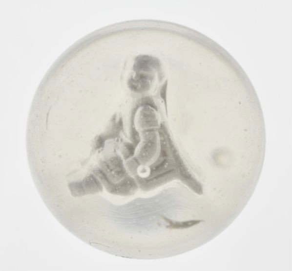 Girl Sitting in Chair Sulphide Marble.: Description Figure is well-centered with great detail. This marble is polished. Photo list: B, C, and D. A different marble with the same figure from the collection of Mrs. William Sigmund, Columbus, 