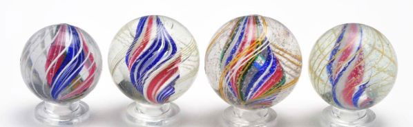 Lot of 4: Swirl Marbles.: Description Includes one white ridge core with red in valleys and blue on ridges. Outer decoration is birdcage yellow latticino. The second marble is a solid core made from ribbons; red stripes on whi