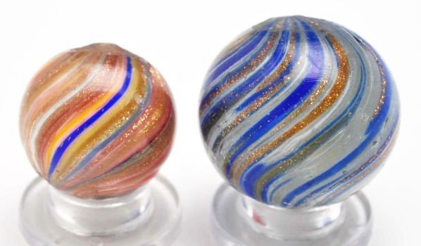 Lot of 2: Onionskin Lutz Marbles.: Description The smaller marble is blue, green, white, yellow, and green loaded with lutz. Photo list: C and D. The larger marble is white, blue, and lutz. Photo list: B, C, and D. Condition (8.9). Siz