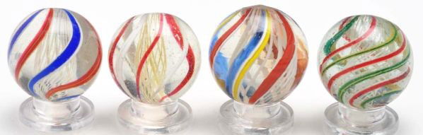 Lot of 4: White Latticino Swirl Marbles.: Description Nice group of white latticino swirls. Condition (9.6). Size Range: 29/32"" to 15/16"" Dia."