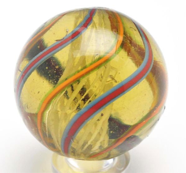 Rare Olive Glass White Latticino Marble.: Description Extremely hard-to-find olive base glass marble. Alternating red accented in blue and orange accented in translucent green. This marble has several subsurface reflections but no glass is mi