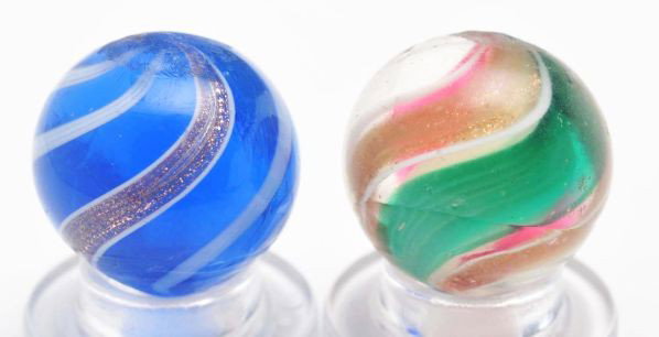 Lot of 2: Lutz Marbles.: Description Includes one with green and red ribbon and another with a blue translucent base and white bands. Condition (8.9). Size Each: 21/32"" Dia."