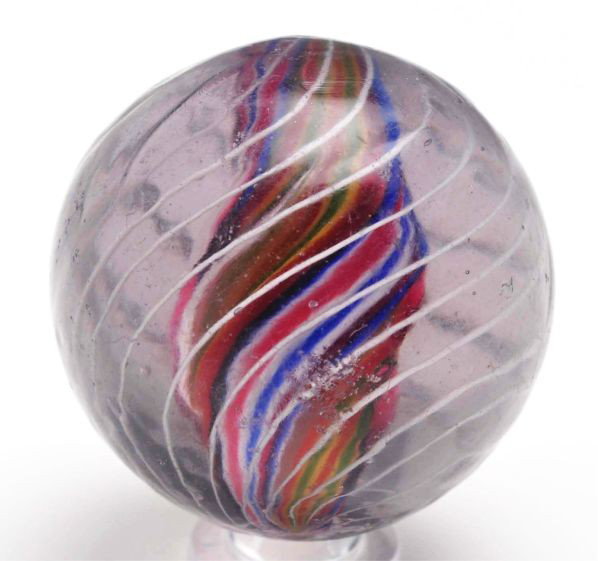 Light Amethyst Divided Core Swirl Marble.: Description Unusual light amethyst glass multicolored divided core with birdcage outer white latticino threads. One as-made hot spot and one minor flea bite. Condition (8.95). Size 1 - 11/16"" Dia."