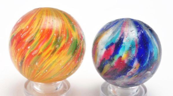 Lot of 2: Handmade Marbles.: Description Includes one white base single pontil end of day with colors in cobalt blue, baby blue, yellow, red, turquoise, and pink. Nice pull of color from top of marble back to pontil. Also include