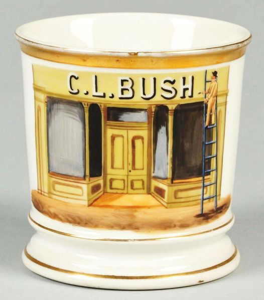 Sign Painter on Ladder Shaving Mug.: Description Gilt name "C.L. Bush". Shows a man painting a sign over a doorway. Green D&C mark on bottom. No cracks, chips, or repairs. This mug is pictured in Robert Blake Powell's book on Occupationa