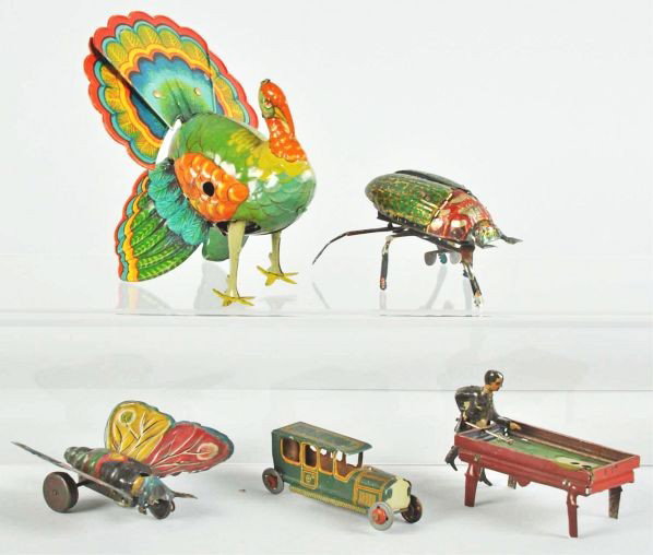 Lot of 5: Tin Litho Animal & Penny Toys.: Description German. Includes one CKO automobile, one pool player, one Lehmann beetle, one butterfly, and one turkey. Various conditions.Condition (Very Good). Size Largest: 5 - 1/2" T.