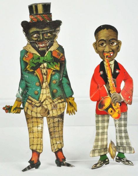 Lot of 2: Tin Litho African-American Squeeze Toys: Description German. Includes one Lehmann man holding bouquet of roses and one saxophone player. Both toys have some scratching, litho loss, and corrosion.Condition (Good - Very Good). Size Largest: 7 