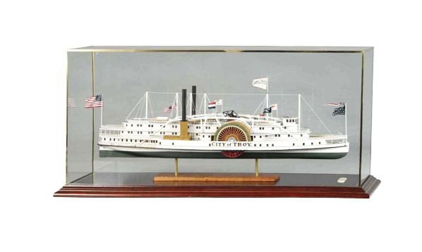 1896 Steamboat "City Of Troy" Model.: Description Built by R. Stewart. Plank-on-frame construction using pine, birch, bass, and boxwood. Historically correct in ever detail.Condition (Near Mint). Size Case: 45" x 15" x 19".