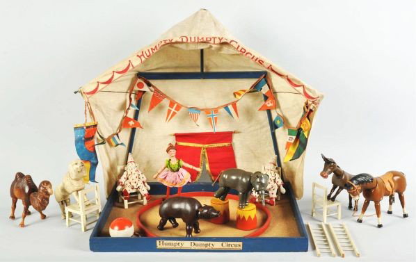 Schoenhut Humpty Dumpty Circus Toy Set.: Description Includes original box with some staining and tearing. Box is marked "Small Circus Ring and Tent" which are included, attached to a wooden frame. Also includes 27 wooden Schoenhut pieces co