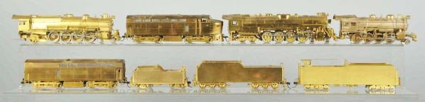 Lot of 4: Brass Train Engine & Tender Sets.: Description Made in Korea. HO Scale. Includes three seam engines with coal tenders and one Baldwin shark nose A & B unit. Includes all original boxes with original foam inserts.Condition (Excellent).