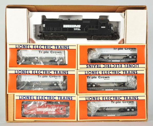 Contemporary Lionel Norfolk Southern Train Set.: Description Circa 1990s. Dash 8-40C unit train. Unused and in original individual boxes and set box. Also includes three boxed flatcars in original boxes.Condition (Near Mint).