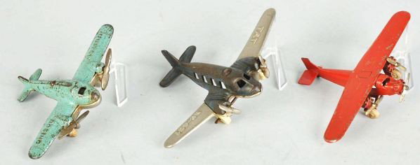 Lot of 3: Cast Iron & Diecast Airplane Toys.: Description American. Includes one Tat NC-491 with replaced rubber wheels, one United Boeing, and one Tootsietoy Tri-Motor Plane with one tail fin broken off and missing.Condition (Good - Very Good). 