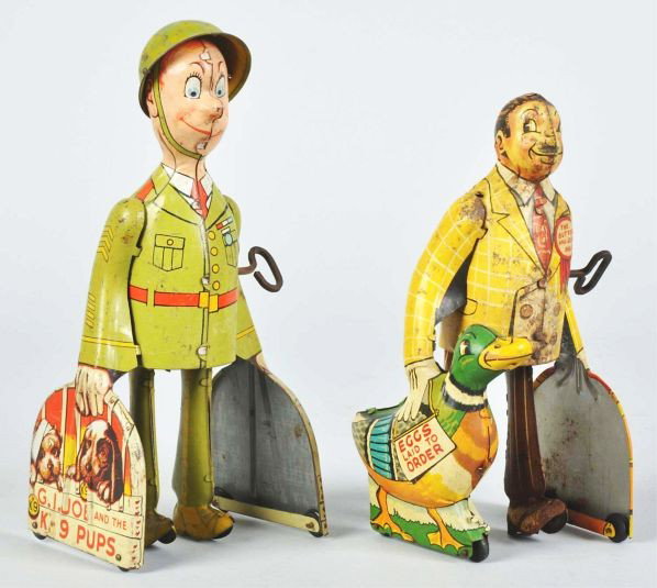 Lot of 2: Tin Unique Art Walking Wind-Up Toys.: Description American. Working. Includes one G.I. Joe and the K-9 Pups and one Butter & Egg Man. Both toys have moderate to heavy scratching and wear, some litho loss to Butter & Egg Man.Condition (Goo