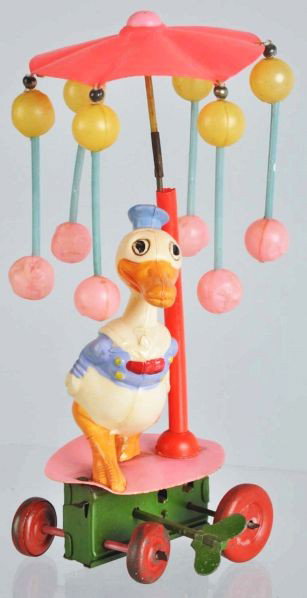 Celluloid Disney Donald Duck Whirligig Toy.: Description Japanese. Pre-war. Marked "Made in Occupied Japan" on rear of Donald figure. Some denting to celluloid balls.Condition (Very Good - Excellent). Size 7" T.
