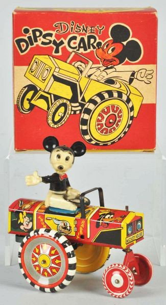 Tin Litho Marx Disney Dipsy Car Wind-Up Toy.: Description American. Working. Plastic head variation. Nice litho of Disney characters around all sides of car. Minor play wear throughout. Includes original crisp box.Condition (Excellent). Size 5 - 