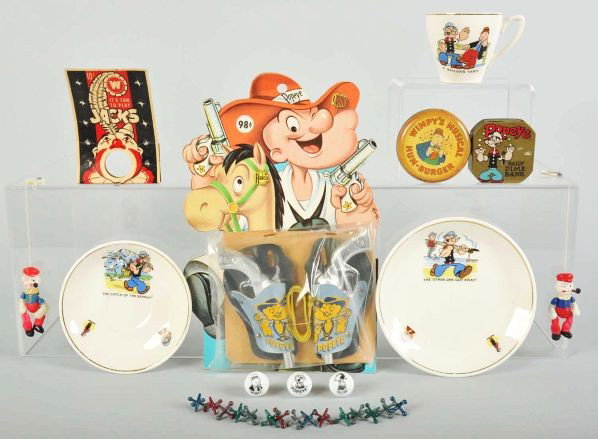 Lot of 9: Popeye Toy & Memorabilia Items.: Description Includes Halco gun and holster set on original card, three pieces of English China, two small rattles, marble and jack set, dime register bank, and Wimpy Hum-Burger. Various conditions.Con