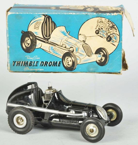 Champion Thimble Drome Gas-Powered Race Car.: Description American. Working. Marked "Made in Santa Ana California". Includes original box missing flaps on one end with some overall creasing and tearing.Condition (Very Good). Size 9 - 1/2" L.