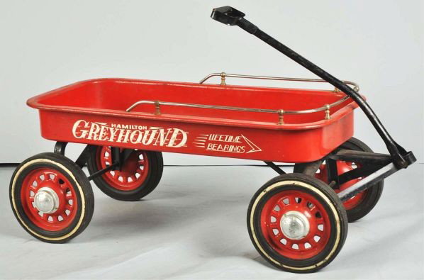Hamilton Greyhound Wagon Pedal Toy.: Description 1950s. Pressed steel. Deluxe model with side rail trim. All original.Condition (Very Good Plus). Size 38" L.