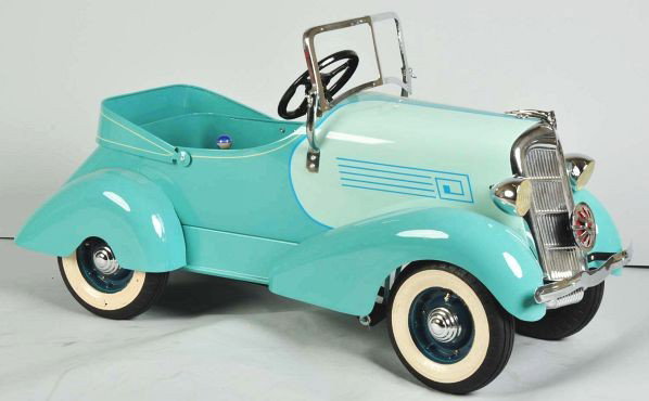Pressed Steel American National Ford Pedal Car.: Description 1935 model. Well-detailed paint scheme and trim. Typical art deco curved fenders, nickel plated grille, dummy lights, and windshield bracket. Professional restoration using remanufactured 