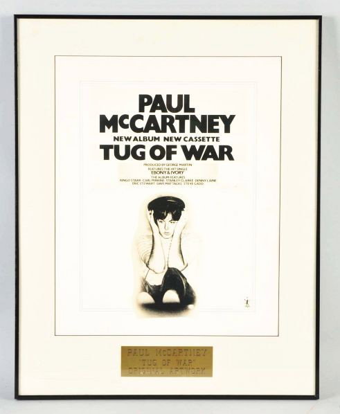 1982 Paul McCartney "Tug of War" Ad Artwork.: Description Framed and matted artwork for an ad in Music Trade papers.Condition (Excellent). Size Framed: 24 - 3/4" x 19 - 3/4".