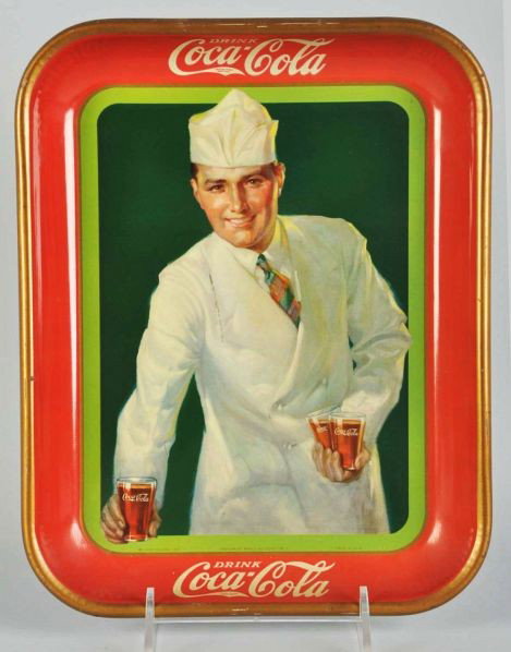 1928 Coca-Cola Serving Tray.: Description Very clean, strong tray with only a few small dark marks. Clean border with only medium soiling, small chips, and nicks.Condition (Very Good - Excellent). Size 13 - 1/4" x 10 - 1/2".