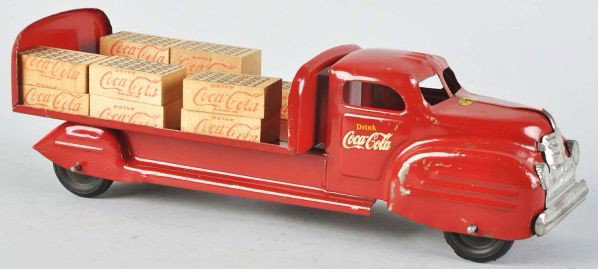 Red Lincoln Coca-Cola Toy Truck.: Description 1940s. Nice Canadian truck with clean appearance. Only mild to medium scuffs, short scratches, and paint chips. Complete with nice wooden cases.Condition (Very Good - Excellent). Size 15 -