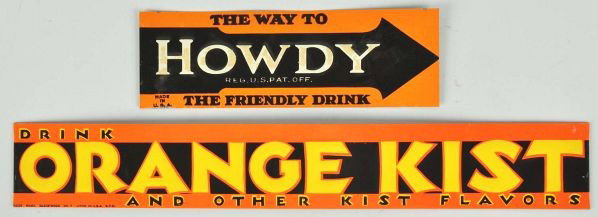 Tin Orange Kist & Howdy Strip Signs.: Description 1940s. Both are embossed, clean, bright, and unused with only minor marks and old paper residue to the Howdy.Condition (Near Mint). Size Largest: 17 - 3/4" L.
