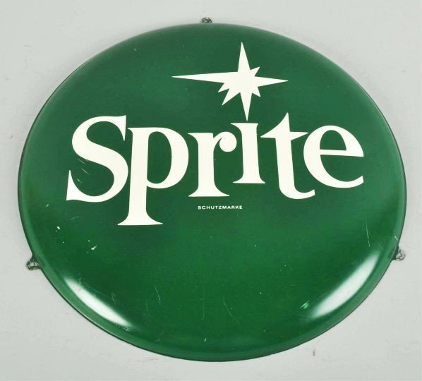 Tin Sprite Button Sign.: Description German. Circa 1960s. A few small scratches, a few short scuffs, light wear, and rusting to back.Condition (Excellent). Size 16" Dia.