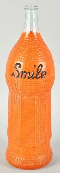 Glass Smile Display Bottle.: Description Circa 1930s. With a July 1922 patent date embossed on bottle. Nicely textured bottle with original orange paint. Only light soiling or wear.Condition (Excellent). Size 18" T.