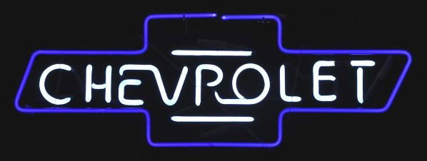 Chevrolet Neon Sign.: Description Chevrolet logo in white and cobalt blue neon mounted on glass rods. Separate transformer is included. Age is uncertain and a collection says 1978.Condition (Excellent). Size 30" L.